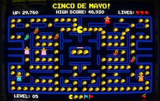 a well known screen view of the arcade game PacMan, this time with tacos...for Cinco De Mayo and Taco Tuesday