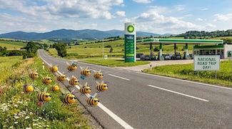 a fun AI generated cartoon of bees flying along a rural highway on a partly cloudy day, near a BP gas/service station for national road trip day in May