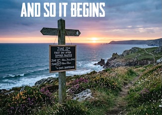 a sign post at a beautiful rocky shoreline at sunset for the first day of summer, signaling that the days now begin to get shorter.