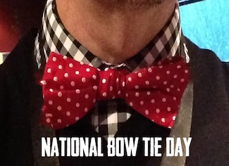 A fancy red with white polka dot bow tie for the national day of celebration for wearing one in August.