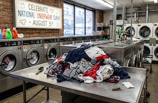 a pile of underwear in a typical city laundromat for national underwear day in August