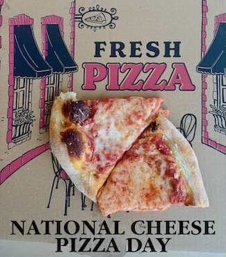 Two slices off cheese pizza on a typical pizza box for national cheese pizza day in September