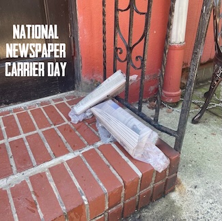 a few plastic bag wrapped newspapers on a doorstep to show how newspapers were delivered in mass by boomers when they were kids decades ago.