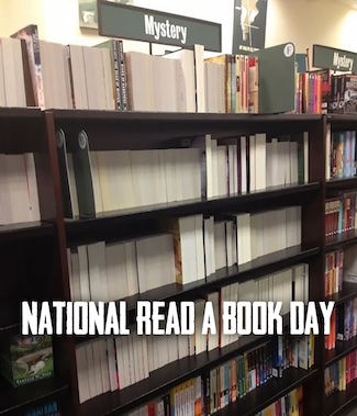 a bookshelf where all the books are turned backwards, for the mystery section in a bookstore, for national read a book day in September