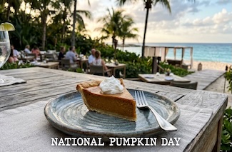 a slice of pumpkin pie on a plate at an outdoor restaurant at a beach resort